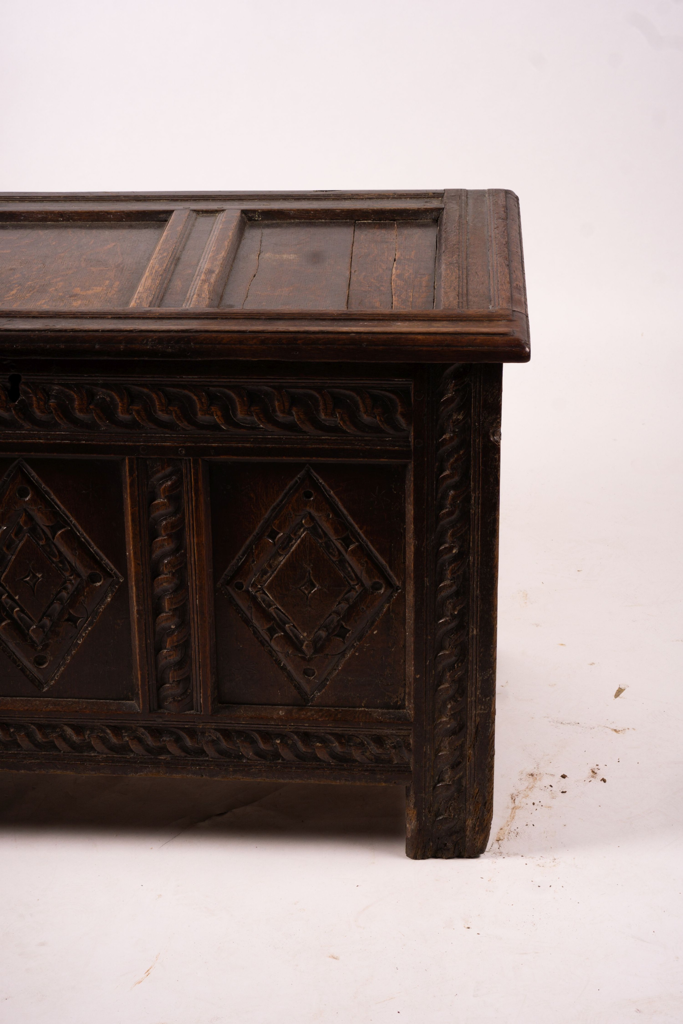 A 17th century carved panelled oak coffer, length 115cm, depth 56cm, height 67cm